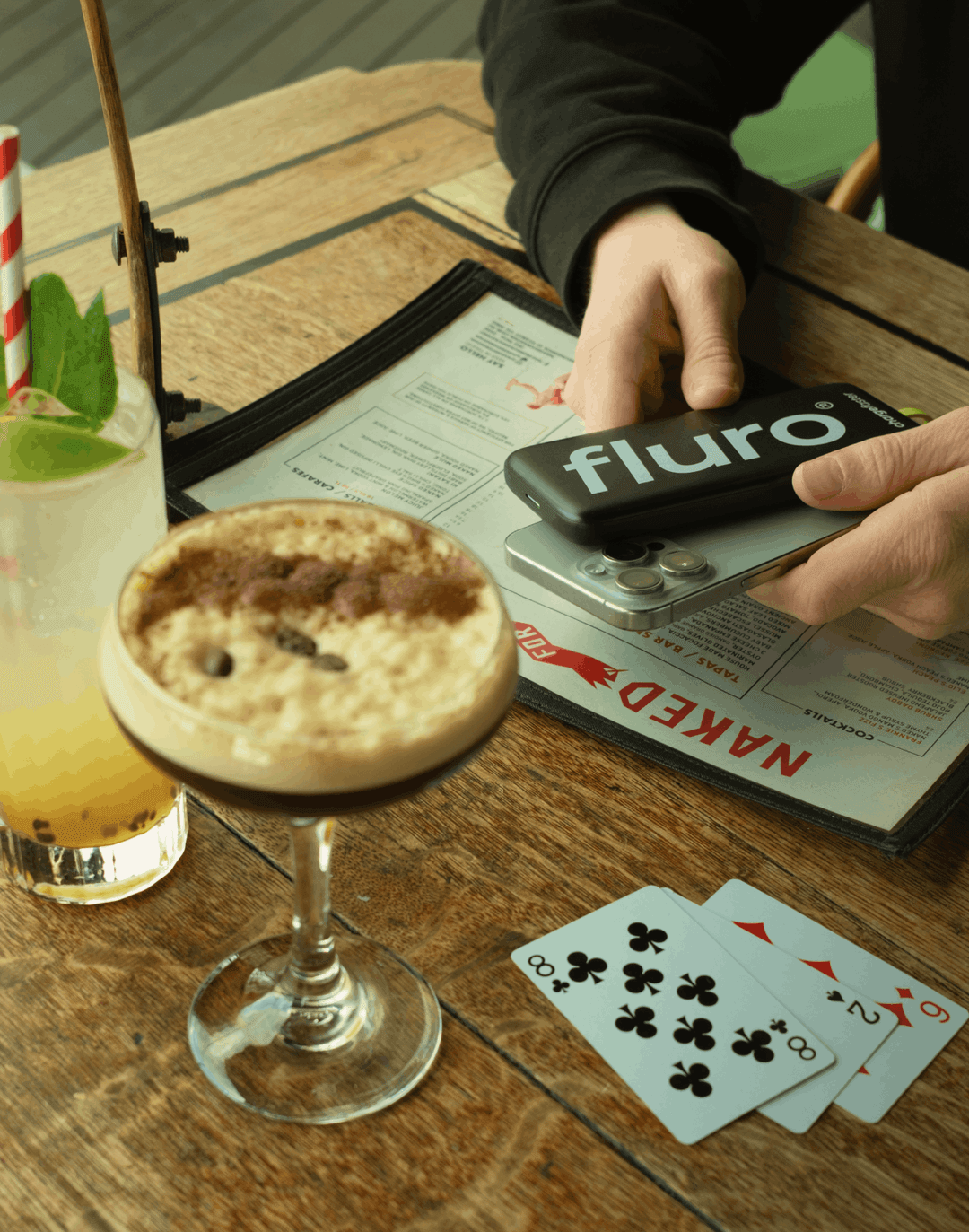 Guests using a Fluro power bank at the bar