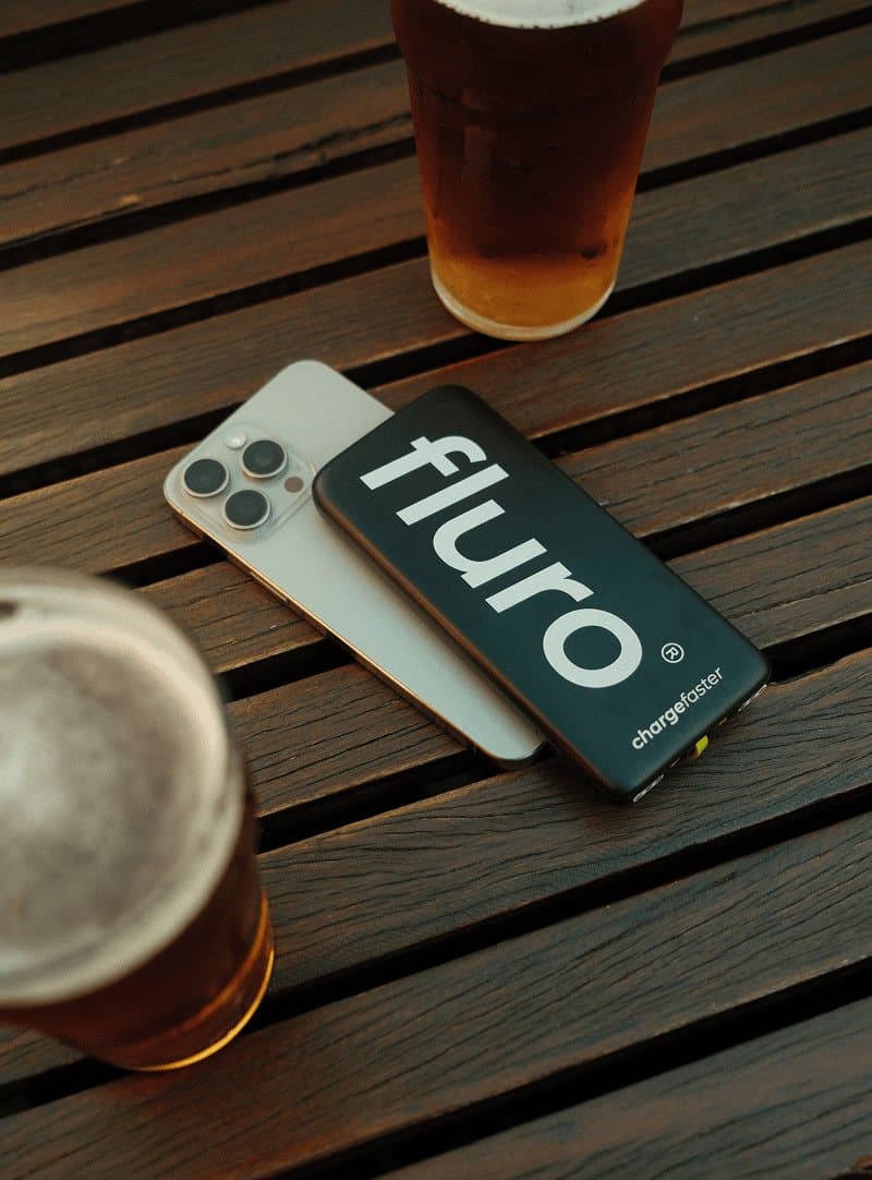 Fluro power bank charging a phone