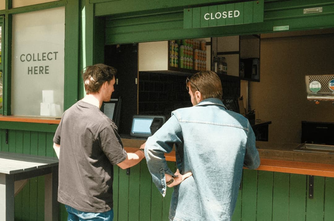 Guests paying at a venue counter